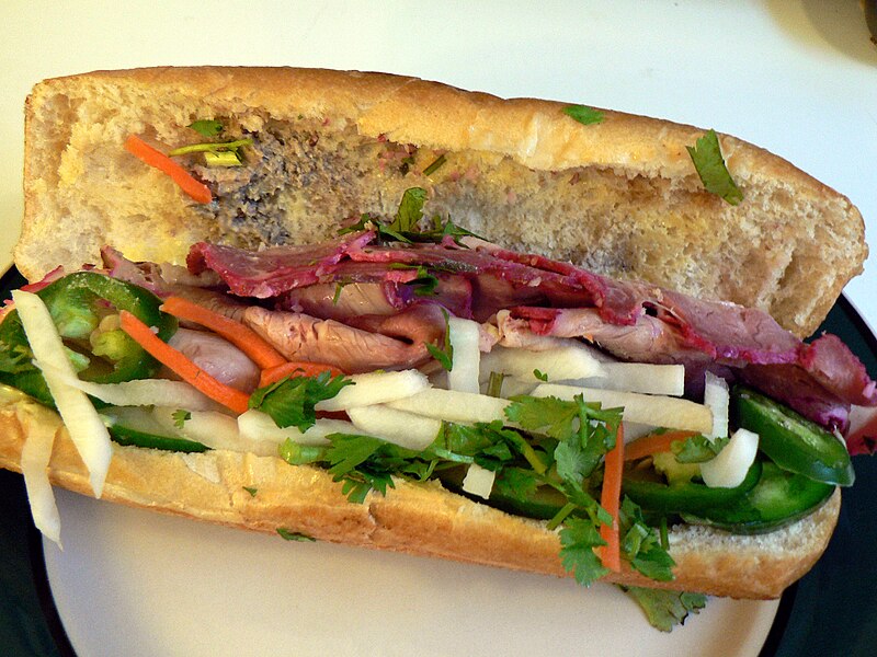 A bánh mì đặc biệt sandwich filled with cold cuts, pâté, herbs and pickles