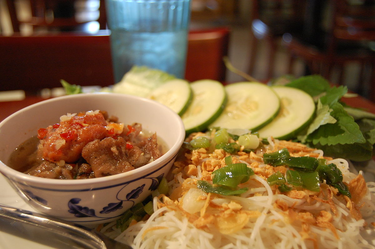 A serving of bún chả — grilled pork patties with rice noodles, herbs and dipping broth