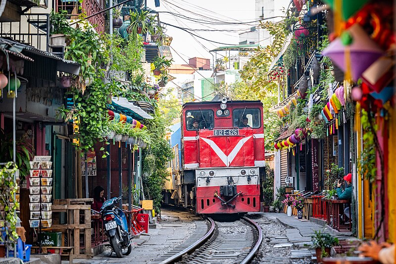 Hanoi street at night with the glow of food stalls